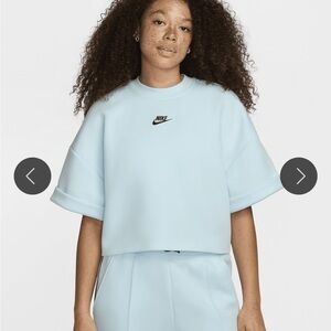 Nike Women’s Pastel Blue Cropped Tech Fleece shirt.